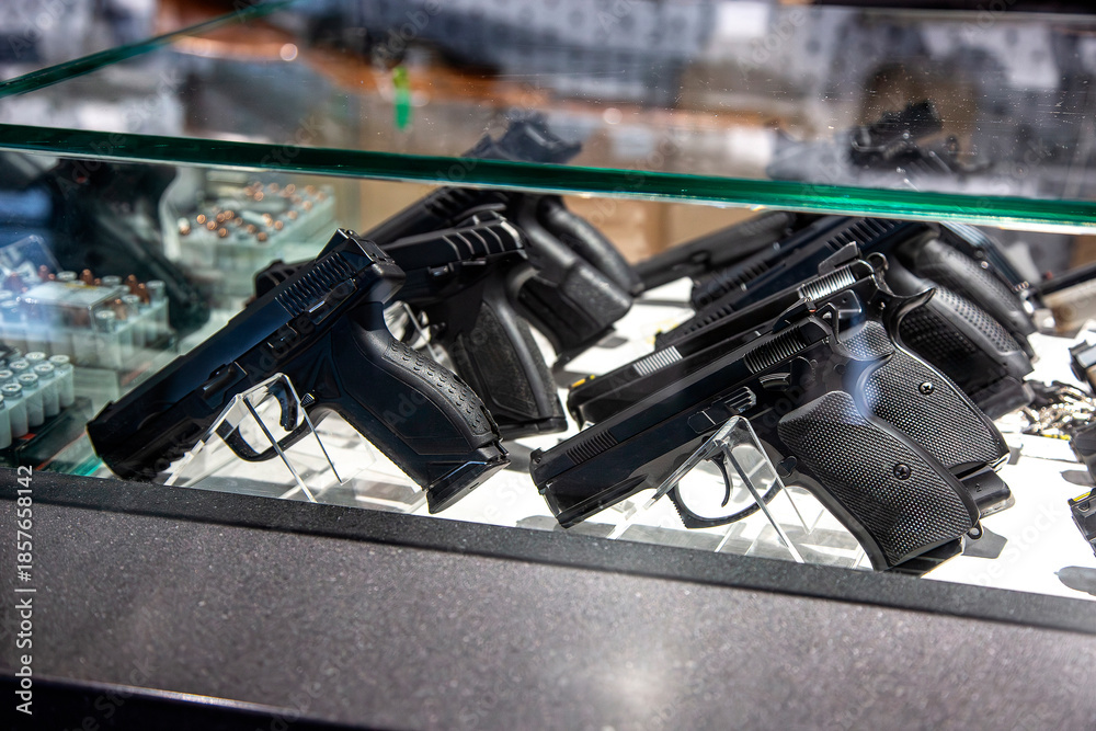 Handguns under glass in the display case